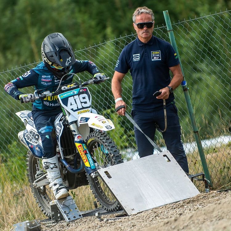 Gate-side with a factory-supported rider